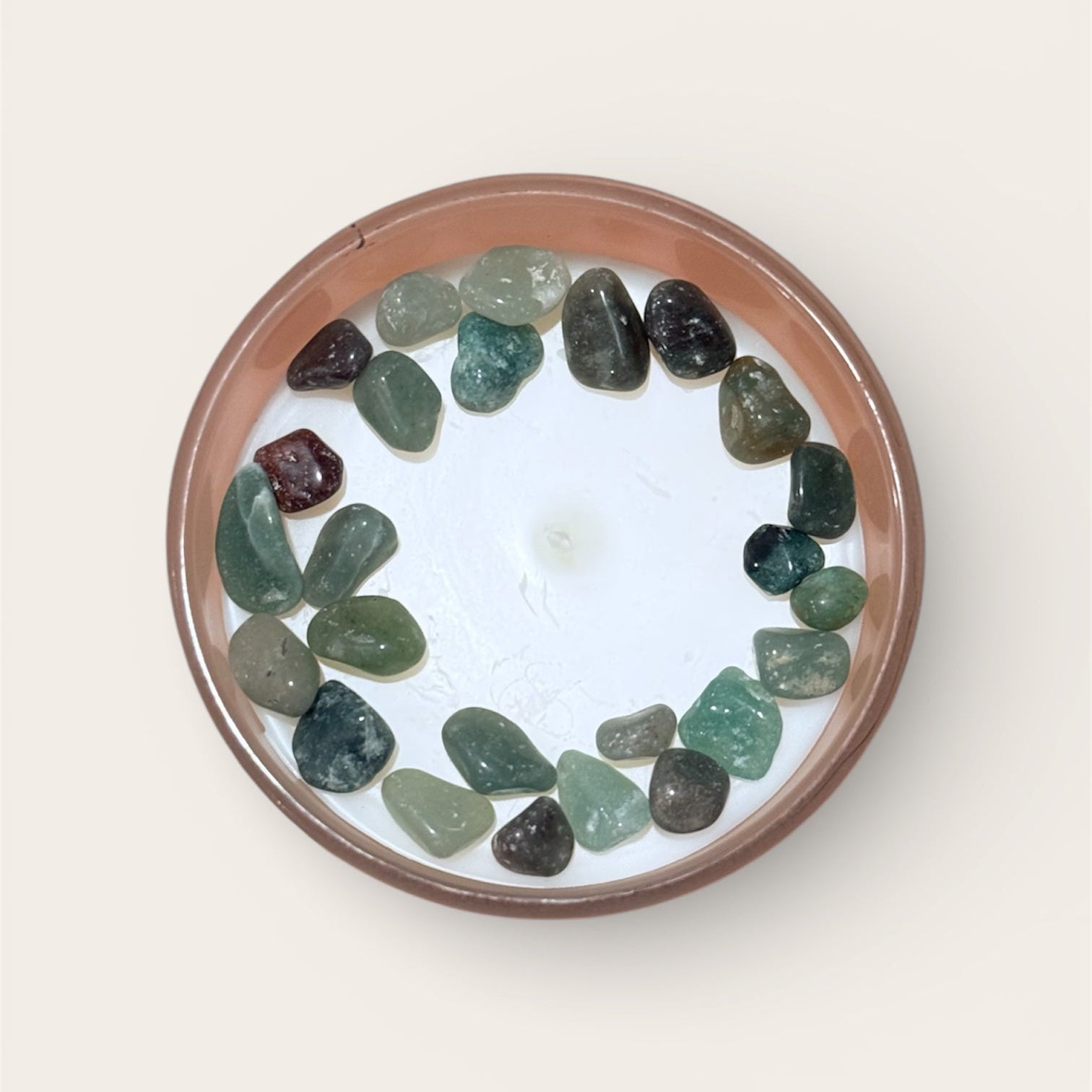 Candle with multicolored aventurine crystals