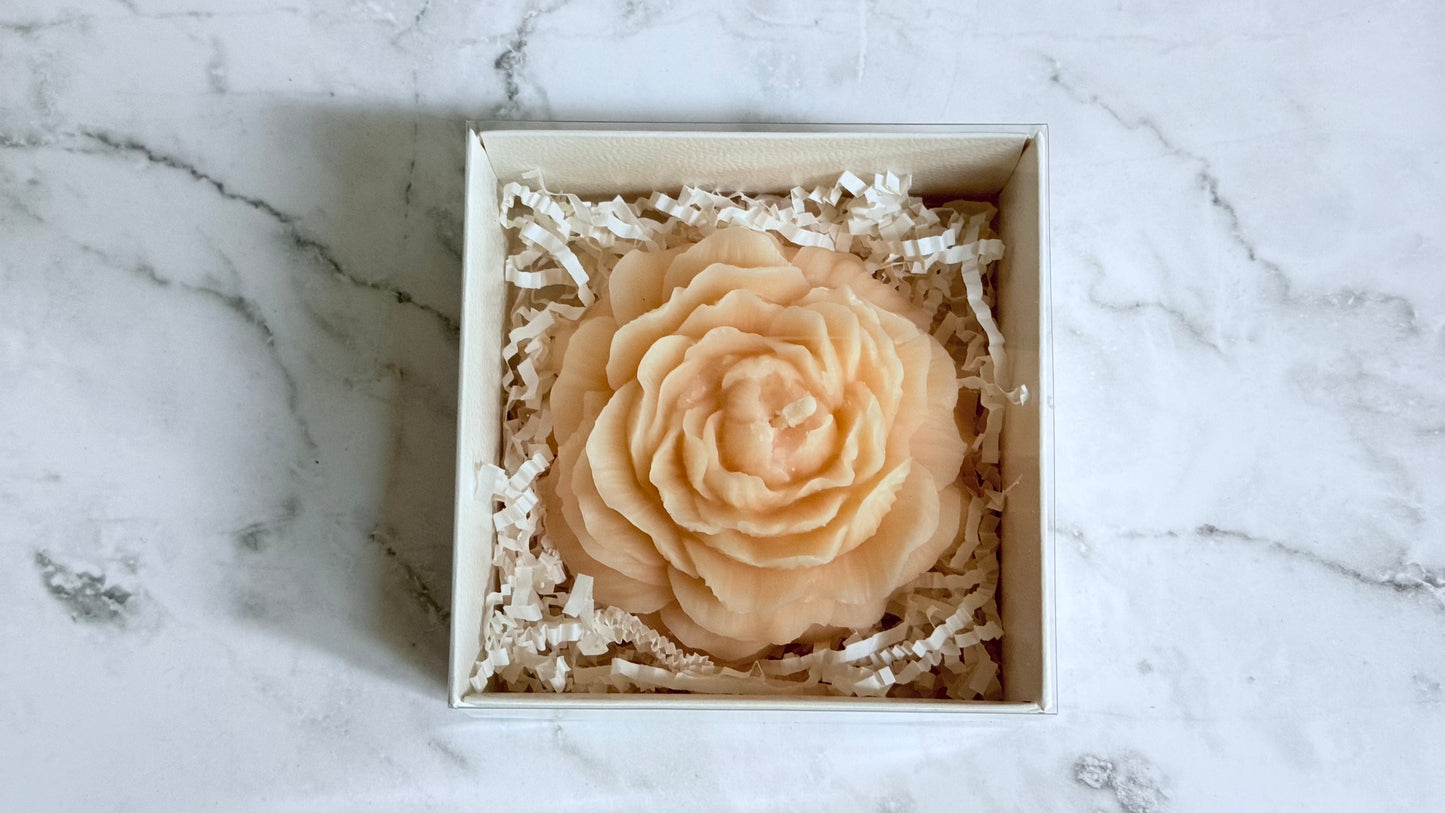 Peony-shaped soap in a box on a marble surface