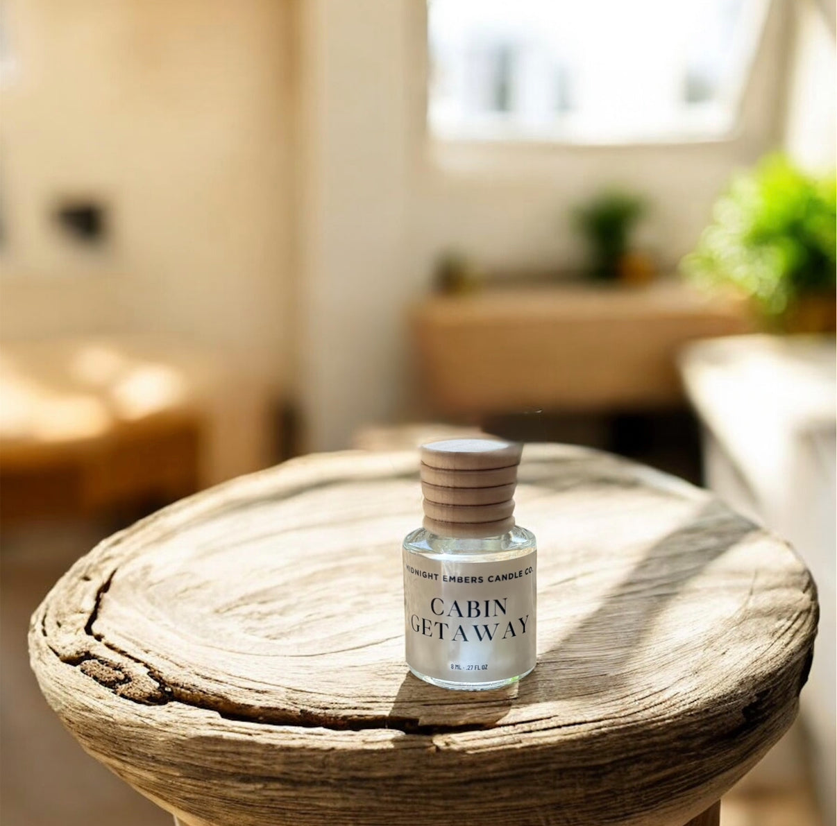 Bottle labeled 'Cabin Getaway' on a wooden table with a blurred indoor background